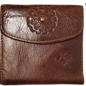 Patricia Nash weathered dark brown leather wallet.